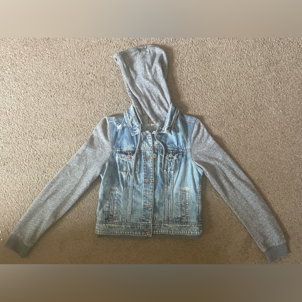 American Eagle Outfitters blue jean jacket with gray sweatshirt sleeves and hood